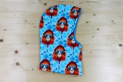 Kapuzen-Buff wendbar "Cool Baboon" türkis-orange